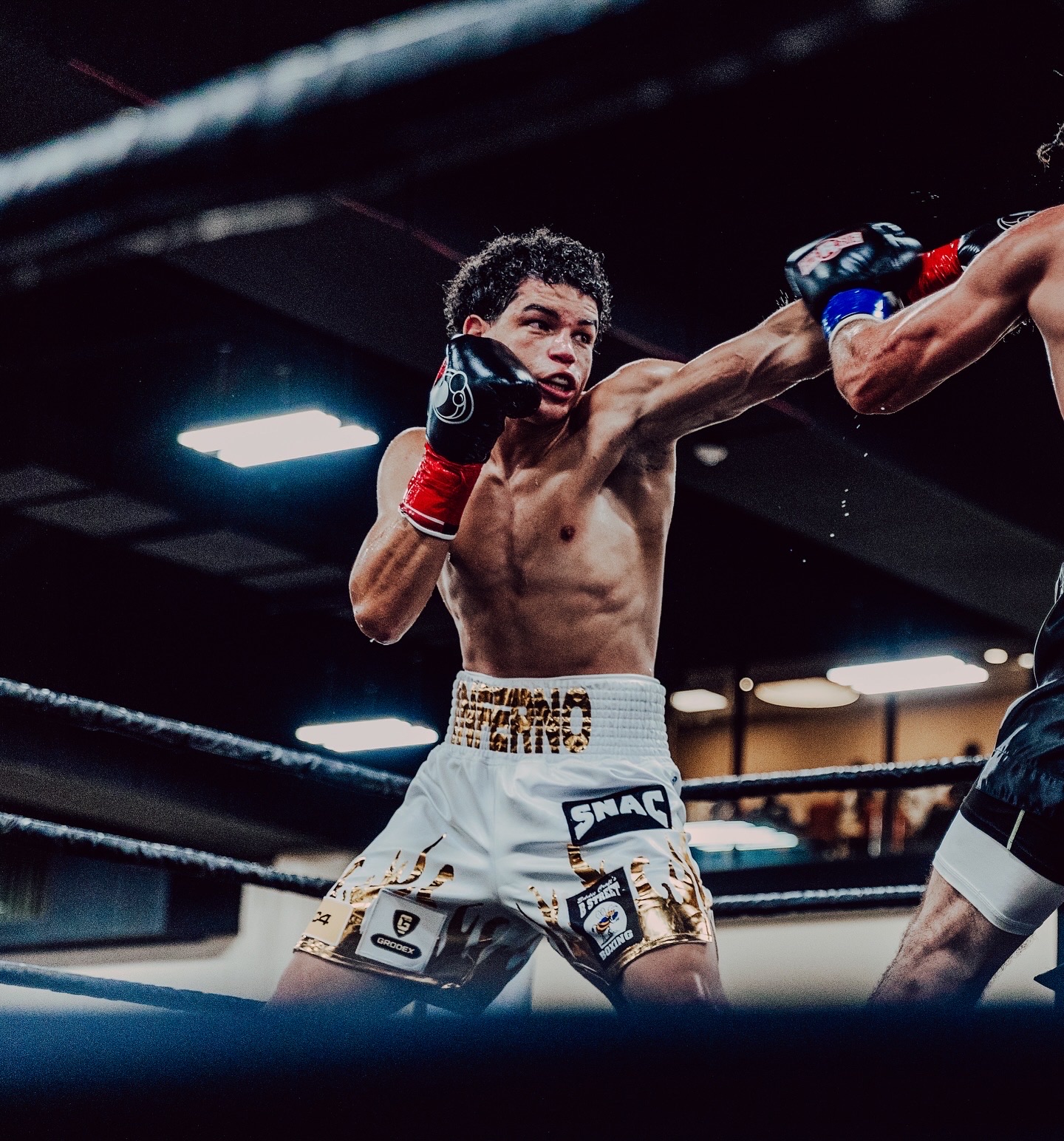 Dante Kirkman landing a punch during a boxing match