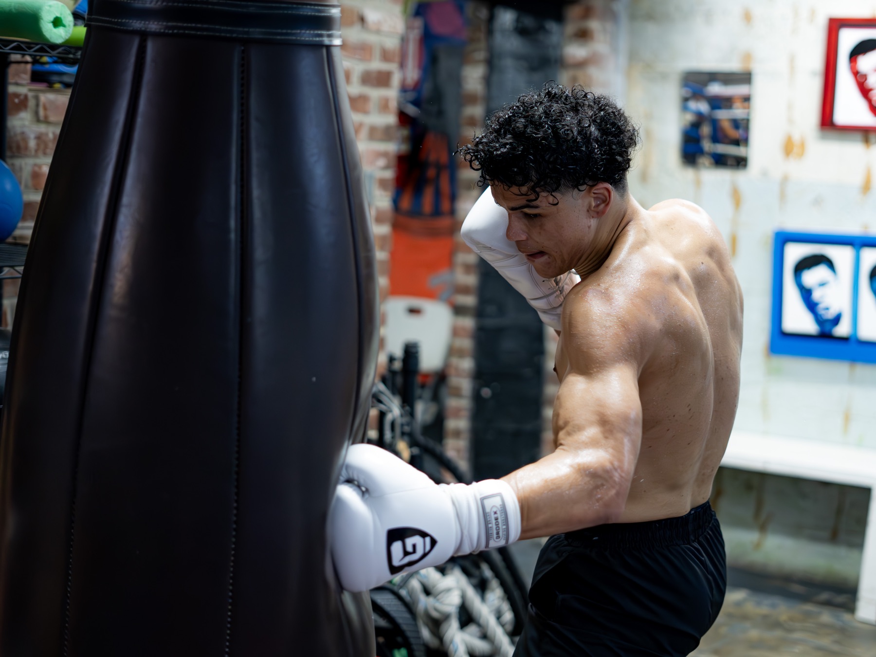 Dante Kirkman punching the heavy bag during power training